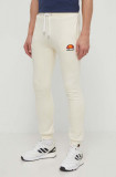 Ellesse pantaloni de trening Ovest Jog Pant culoarea bej, cu imprimeu, SHV01763