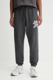 Tommy Jeans pantaloni de trening din bumbac culoarea gri, cu imprimeu, DM0DM22083