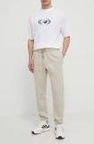Under Armour pantaloni de trening culoarea bej, neted