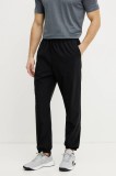 On pantaloni de antrenament Focus culoarea negru, neted, 1ME30390553
