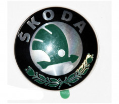 Emblema auto Skoda Octavia 1 (1U2/1U5) 1997-2010, Fabia 1 04.2000-03.2007, Felicia 1998-06.2001, fata , logo masca fata foto