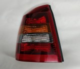 Stop spate lampa Opel Astra G Sedan 01.1998-08.2009 BestAutoVest partea Stanga, fumuriu, fara suport becuri -URME MICI DE ZGARIETURI