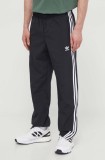 Adidas Originals pantaloni Adicolor Woven Firebird Track top bărbați, culoarea negru, cu model, IT2501