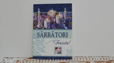 FELICITARE DE CRACIUN SI AN NOU - ARANJAMENT DE LUMANARI SI FLORI - SCRISA. foto