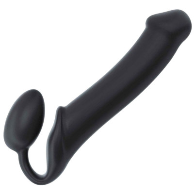 Dildo din silicon, penis artificial cu curea atașat la vagin. foto