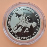 50 bani 2017 - 10 ani de la aderarea Rom&acirc;niei la Uniunea Europeană - PROOF , moneda nu a fost scoasa din capsula, poze in lumina naturala