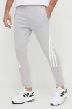 Cumpara ieftin Adidas pantaloni de trening culoarea gri, uni IR9203