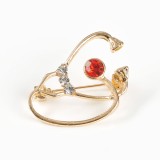 Brosa martisor stetoscop auriu