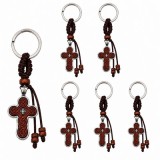 Cumpara ieftin Set 6 brelocuri religioase maro-argintiu 9.5 cm, cruciulite crestine 4 cm gravate, spate metalic, snur impletit cu margele din lemn, inel 2.9 cm, mart