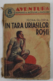 IN TARA URIASILOR ROSII - roman de aventuri de MONA GLORIA , EDITIE INTERBELICA , PREZINTA URME DE UZURA , COTOR CU DEFECTE , PETE