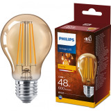 Bec LED vintage (decorativ) Philips Classic, E27, 5.5W (48W), 600 lm, 2500K, Clasa energetica F, flacara, Gold