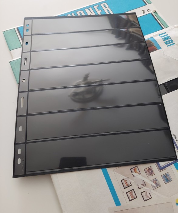 25 de coli LINDNER UNIPLATE, negre, cu 7 randuri pentru timbre, noi, sigilate