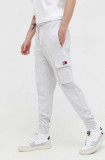 Tommy Jeans pantaloni de trening din bumbac culoarea gri, melanj