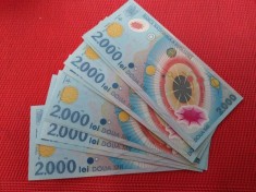 11 bancnote noi de 2.000 lei cu eclipsa