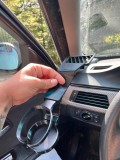 Suport pentru pahar compatibil cu BMW Seria 3 E90, conceput pentru montare &icirc;n zona gurii de ventilație din partea șoferului.