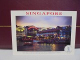 SINGAPORE - CLARKE QUAY , care traverseaza ca un pod riul spre RIVERSIDE POINT unde vei gasi dragute diverse magazine - vedere nocturna -