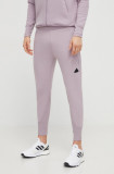 Cumpara ieftin Adidas pantaloni de trening Z.N.E culoarea roz, uni IR5214