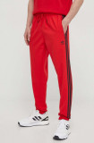 Cumpara ieftin Adidas Originals pantaloni de trening culoarea roșu, cu imprimeu IS2808