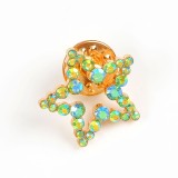 Brosa martisor stea aurie cu pietre multicolore