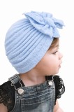 Caciulita bleu tip turban cu model din tesatura si funda aplicata (Marime