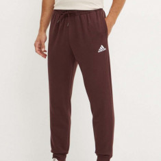 adidas pantaloni de trening Essentials culoarea maro, cu imprimeu, IY9086