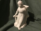 Vaza tip bibelou figura feminina sprijinita de un gard din lemn cu un cos din nuiele in spate model deosebit din portelan biscuit prima parte a sec XX