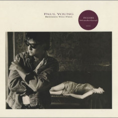 VINIL Paul Young ‎– Between Two Fires (VG+)