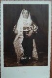 Fotografie tip carte postala, femeie in port popular, perioada interbelica