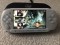 PlayStation PSP E1004 60 jocuri Modat 64Gb Husa incarcator GTA GOD OF WAR STAR WARS CULOARE ALB