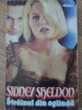 STRAINUL DIN OGLINDA-SIDNEY SHELDON