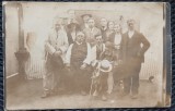 Fotografie tip Carte Postala, Grup mde barbati si femei la Haramul bisericii din sarul Duinigi judetul Constanta, 1924