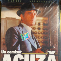 UN COMISAR ACUZA,DVD SIGILAT cu HOLOGRAMA