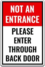 Not an entrance please enter through back door sign foto
