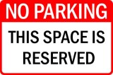 Sign no parking this space is reserved
