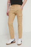 Tommy Jeans pantaloni bărbați, culoarea bej, mulată DM0DM18940