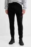 Helly Hansen pantaloni de trening culoarea albastru marin, cu imprimeu
