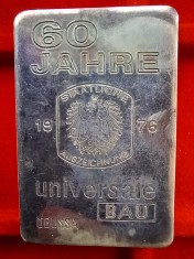 (A50) LINGOU DIN ARGINT 100 GRAME - OGUSSA, 60 JAHRE UNIVERSALE BAU, PURITATE 999, IDEAL PENTRU INVESTITIE IN METALE PRETIOASE