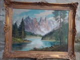 Ulei pe p&acirc;nză peisaj montan o lucrare foarte veche semnata &icirc;ncadrată &icirc;ntr-o ramă lata din lemn masiv in stilul Baroc, Peisaje, Realism