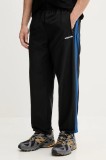 adidas Originals pantaloni de trening Brushed WVN culoarea negru, cu imprimeu, JX3078